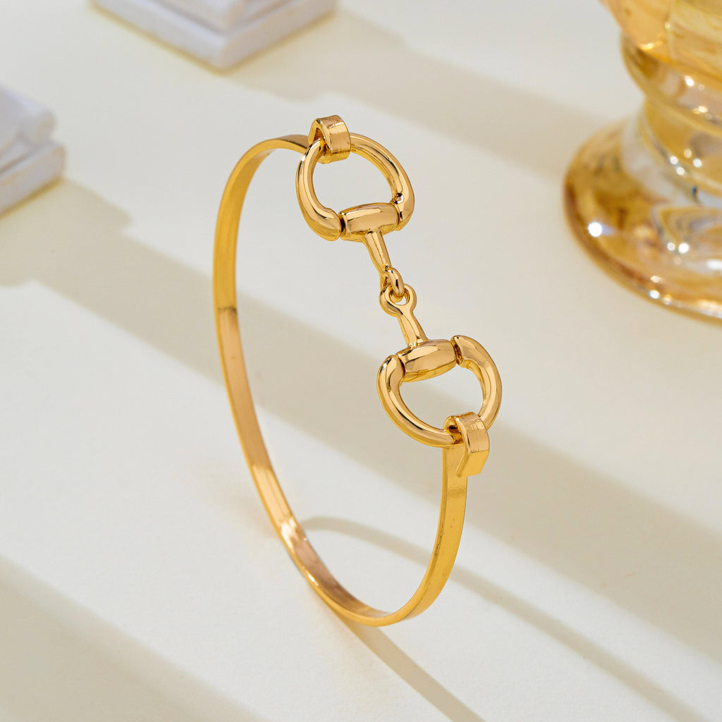 Horsebit Centerpiece Gold-Tone Bangle Bracelet | 80B1951