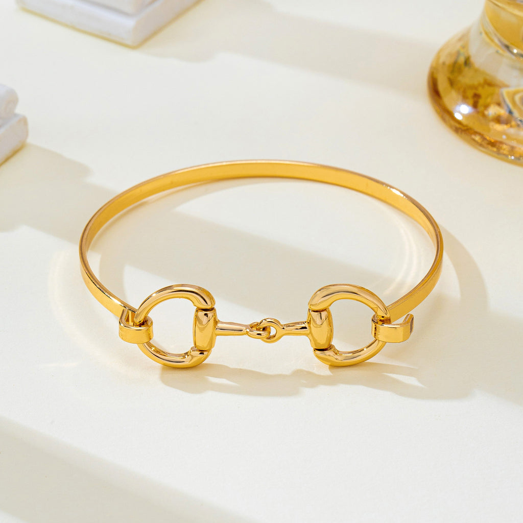 Horsebit Centerpiece Gold-Tone Bangle Bracelet | 80B1951