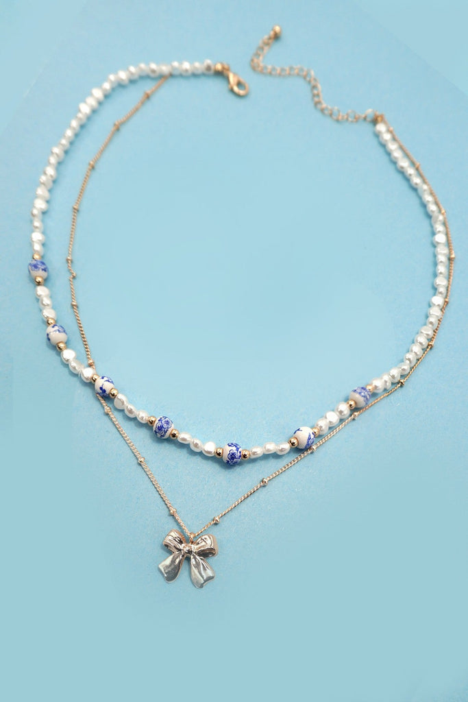 CERAMIC PORCELAIN PEARL BOW LAYER NECKLACE | 80N91555