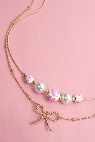 PINK CERAMIC PORCELAIN PEARL BOW LAYER NECKLACE | 80N91556