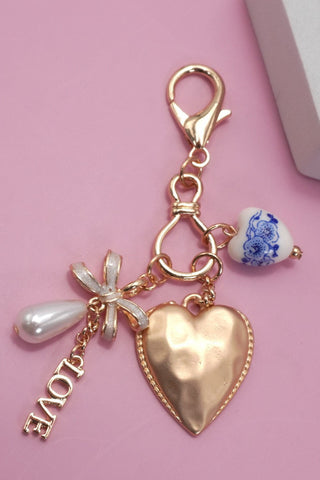 PORCELAIN BOW HEART LOVE BAG CHARM | 80K011