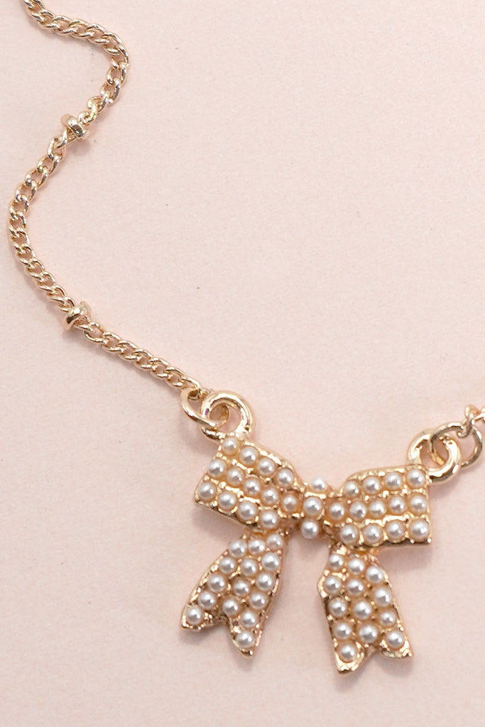 PEARL BOW CHARM BALL CHAIN NECKLACE | 80N91620