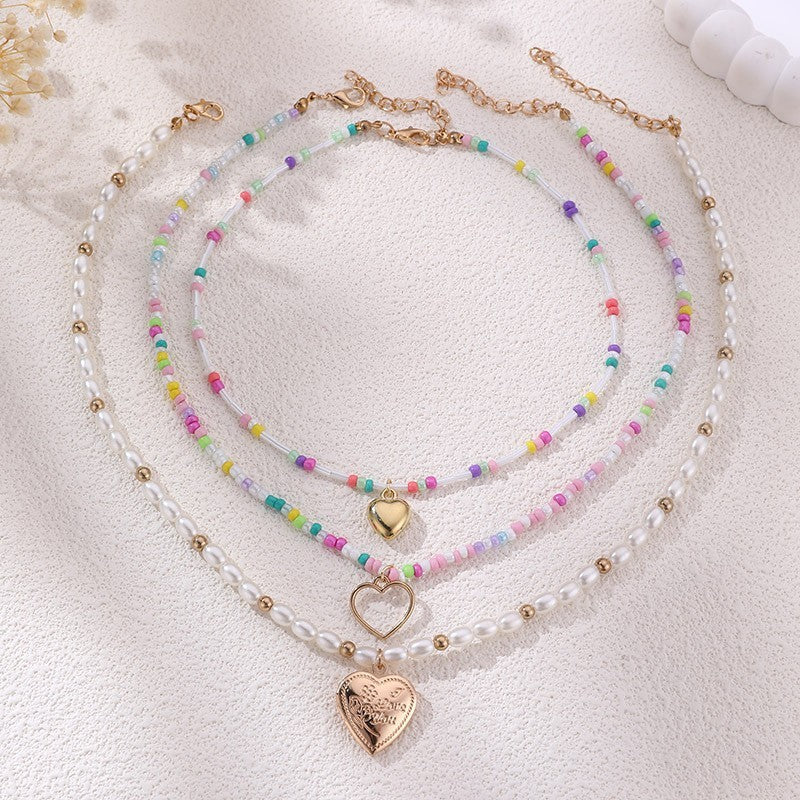 MULTI LAYER BEADED CHAIN HEART CHARM NECKLACE | 40NK9472