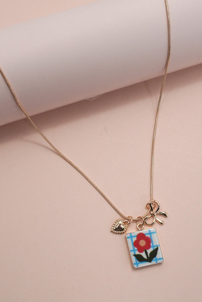 PORCELAIN CLUSTER CHARM BOW HEART NECKLACE | 80N91840