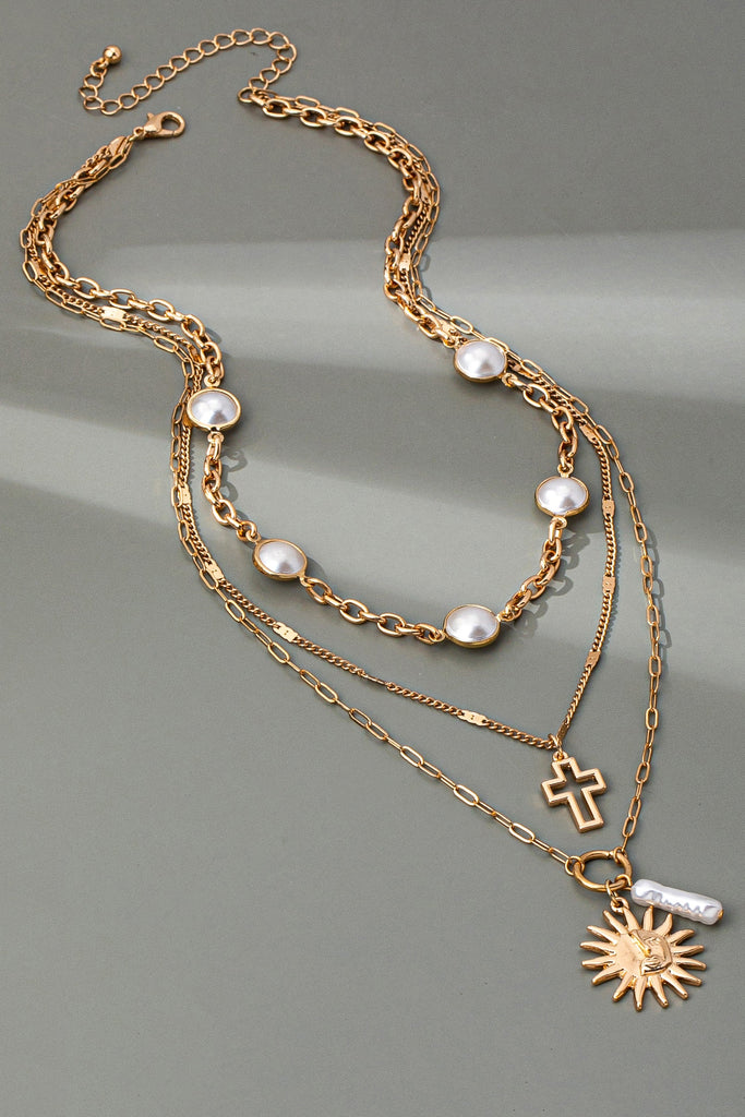 MULTI PEARL LAYER PEARL SUN CROSS CHARM NECKLACE | 80N92503