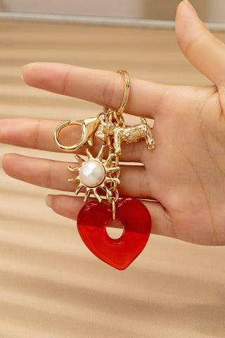 BAG CHARM KEY CHAIN-RESIN HEART DOG PEARL SUNBLAST | 80K092