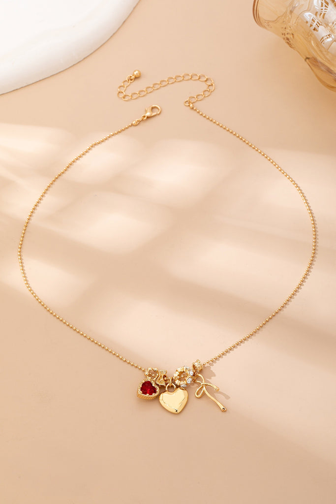 Multi-Charm Heart and Bow Necklace | 80N92882