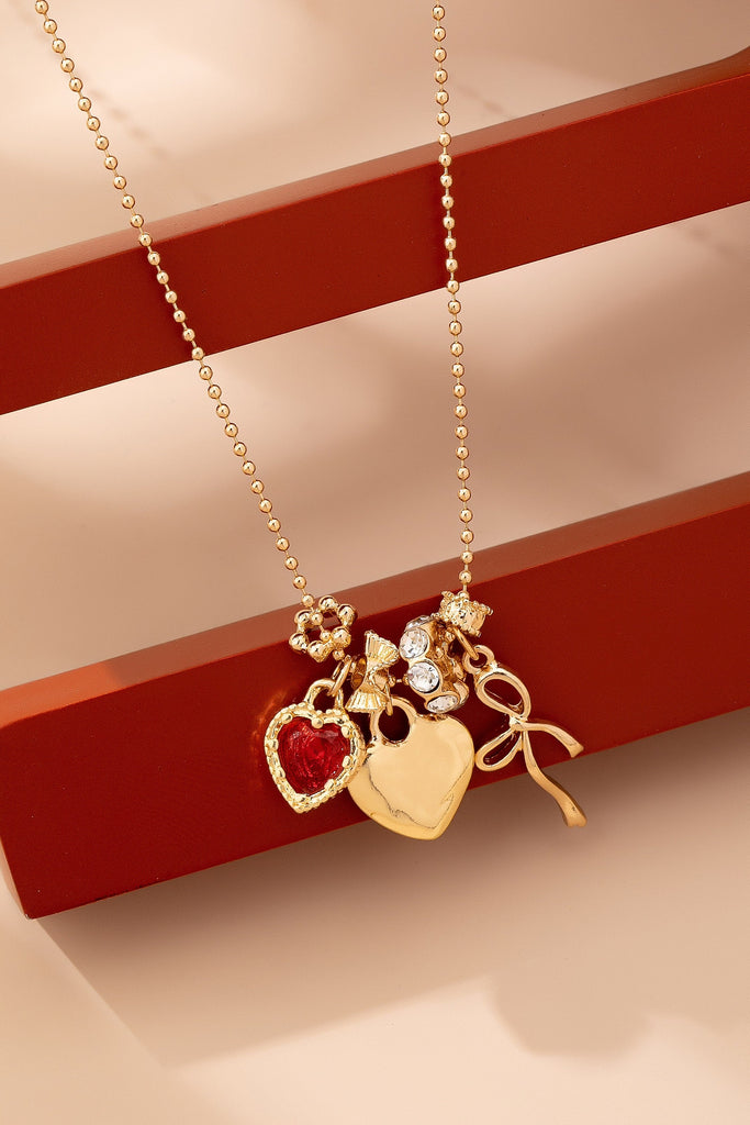 Multi-Charm Heart and Bow Necklace | 80N92882