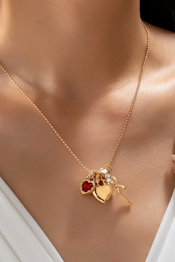 Multi-Charm Heart and Bow Necklace | 80N92882