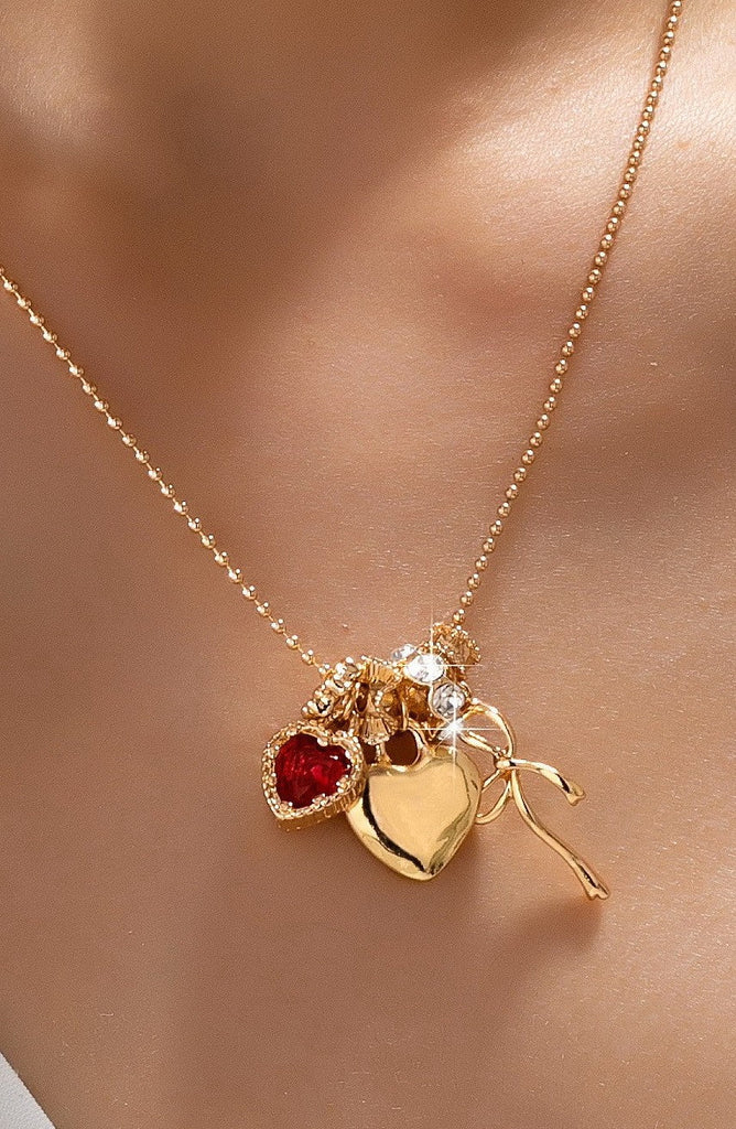 Multi-Charm Heart and Bow Necklace | 80N92882