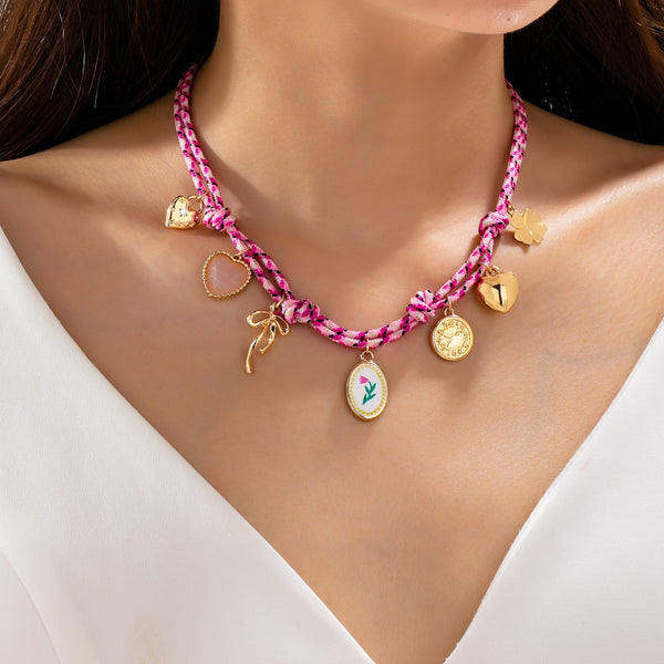 Corded Multi Charm Bow Heart Floral Necklace | 80N93440